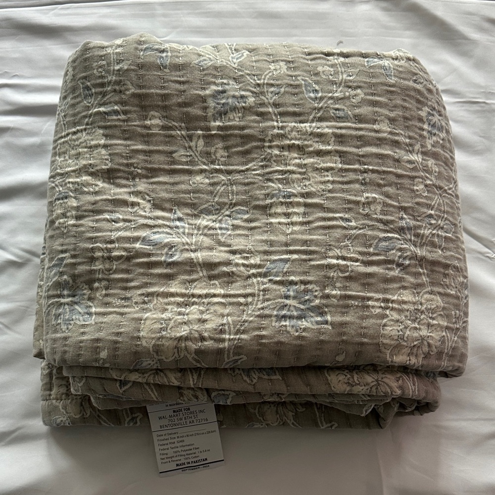 Floral Patterned Tan and Blue Quilt